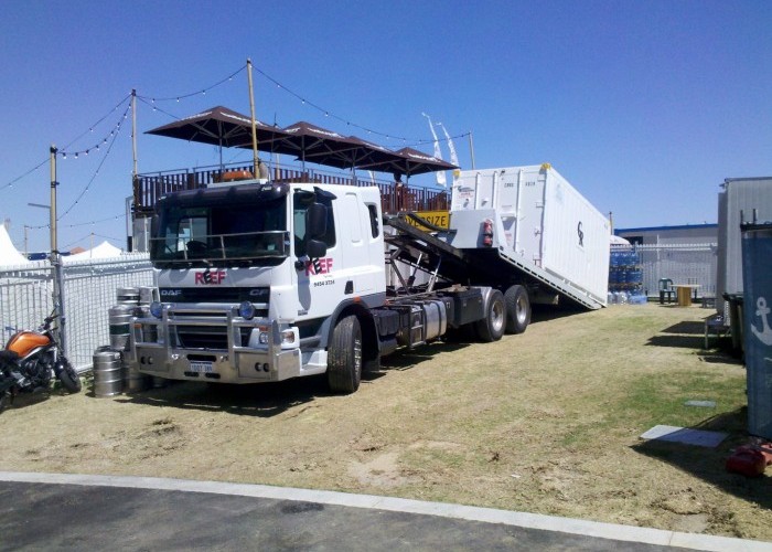 Image of tilt tray delivering a sea container for Fringe World