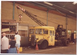 vintage photo of a hiab crane transporting items in the 80s